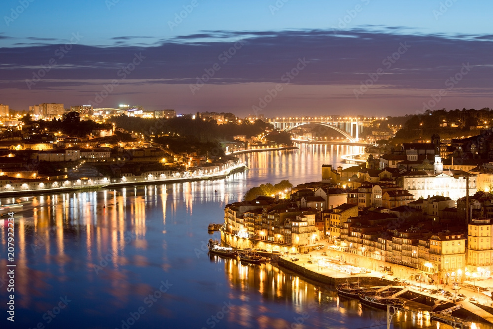 Porto by night. Cityscape over the Douro River