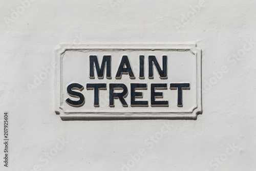 Main Street sign on a white wall in the British overseas territory of Gibraltar © Val Traveller