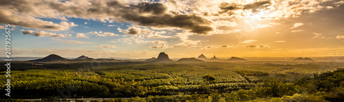 Panoramic view of Glass House Mountains at sunset visible from Wild Horse Mountain Lookout