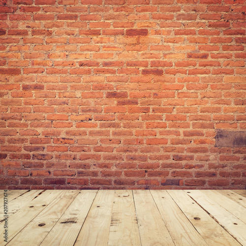 Old brick wall and wooden floor room background texture.