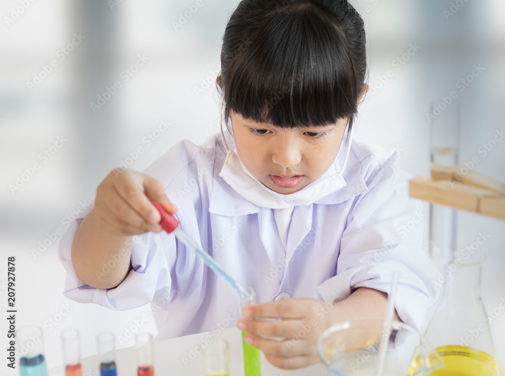 Asian girl doing laboratory test, science classroom Asian girl doing laboratory test, science classroom
