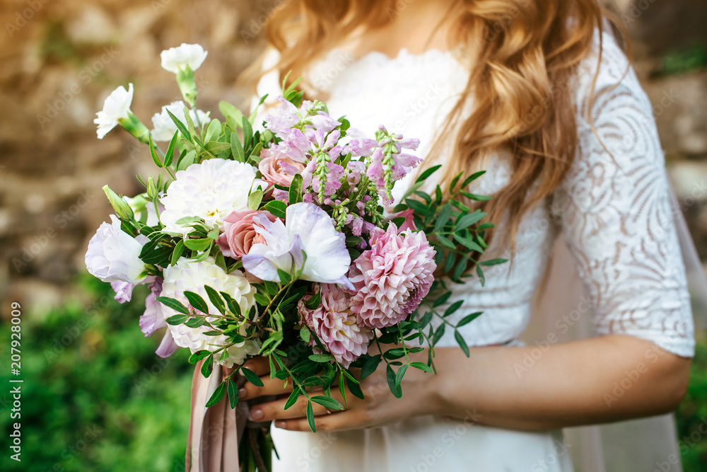 trendy wedding bouquet in bride's hands