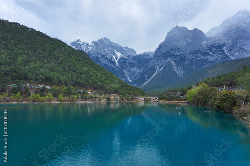 Beautiful view of Blue Moon Valley in Jade Dragon Snow Mountain reflected in clear water. It's in Lijiang, Yunnan, China 