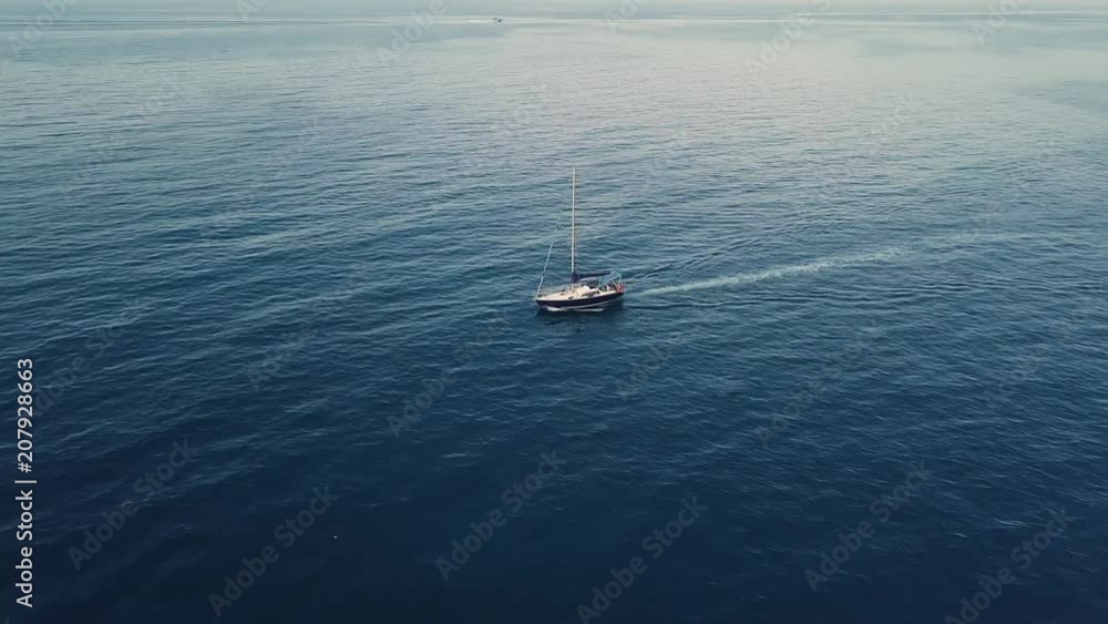 4k low angle aerial of sailing boat in blue seas 4k low angle aerial of sailing boat in blue seas