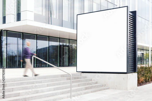 Outdoor billboard mockup with white copy space to add company names and logos in modern business district