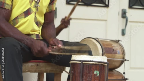 Traditionally dressed caribbean reggae musicians, band. Jamaican street music - March 2018: Falmouth, Jamaica