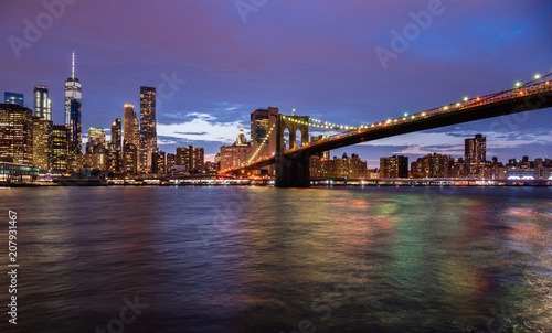 New York city USA. Sunset over Manhattan and Brooklyn bridge