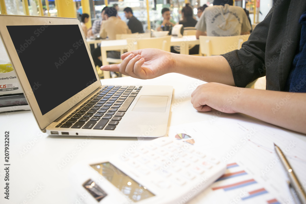 Young women are checking the company's finances to prepare for further business development. Young women are checking the company's finances to prepare for further business development.
