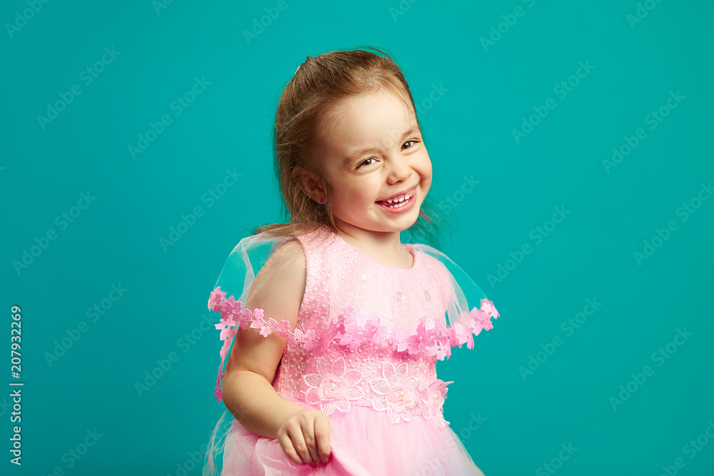 Cheerful little girl in beautiful pink dress Cheerful little girl in beautiful pink dress