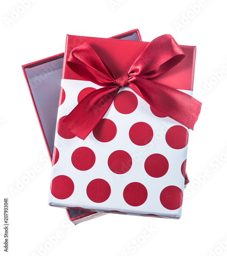 Opened red present box with ribbon isolated on white