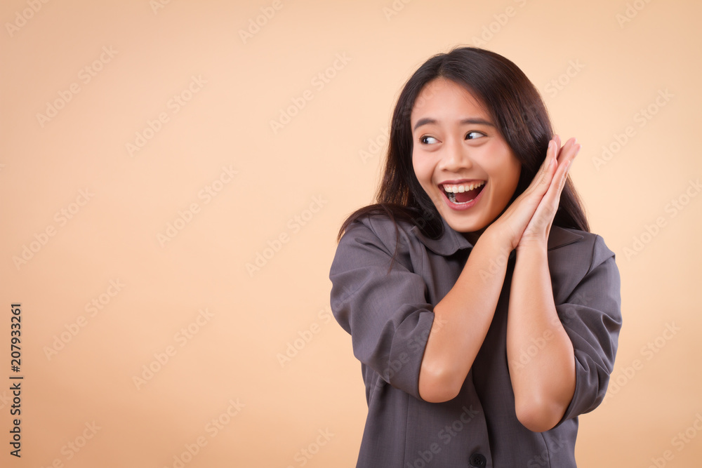 portrait of excited happy smiling asian business woman; happy smiling successful excited surprised business woman looking up; asian 20s young adult woman model portrait of excited happy smiling asian business woman; happy smiling successful excited surprised business woman looking up; asian 20s young adult woman model