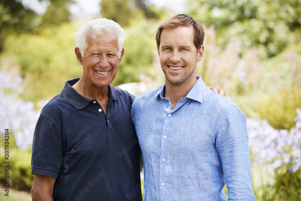 Portrait Of Senior Father With Adult Son On Walk In Park Portrait Of Senior Father With Adult Son On Walk In Park