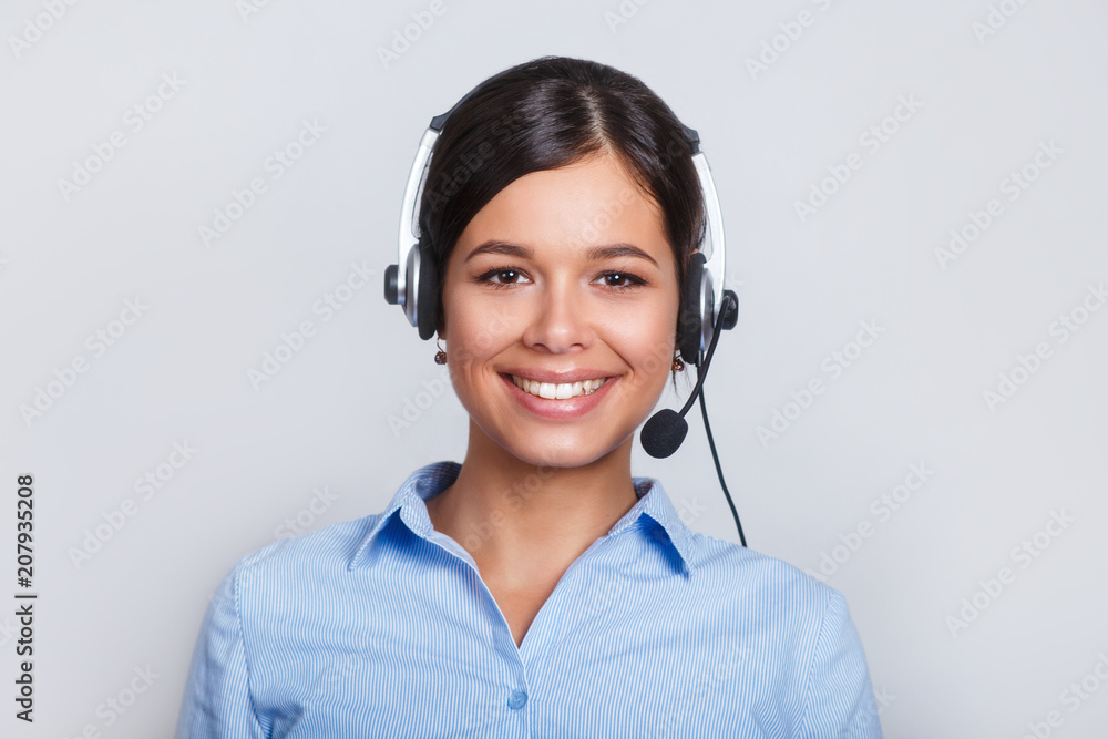 customer support phone operator in headset, with blank copyspace area for slogan or text message, over grey background. Consulting and assistance service call center. customer support phone operator in headset, with blank copyspace area for slogan or text message, over grey background. Consulting and assistance service call center.