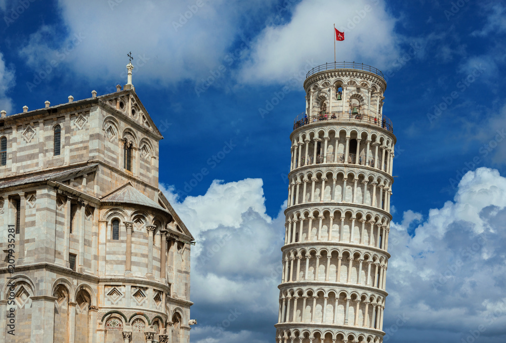 Square of Miracles landmarks: Pisa Cathedral and the famous Leaning Tower, among beautiful clouds. Unesco Wolrld Heritage