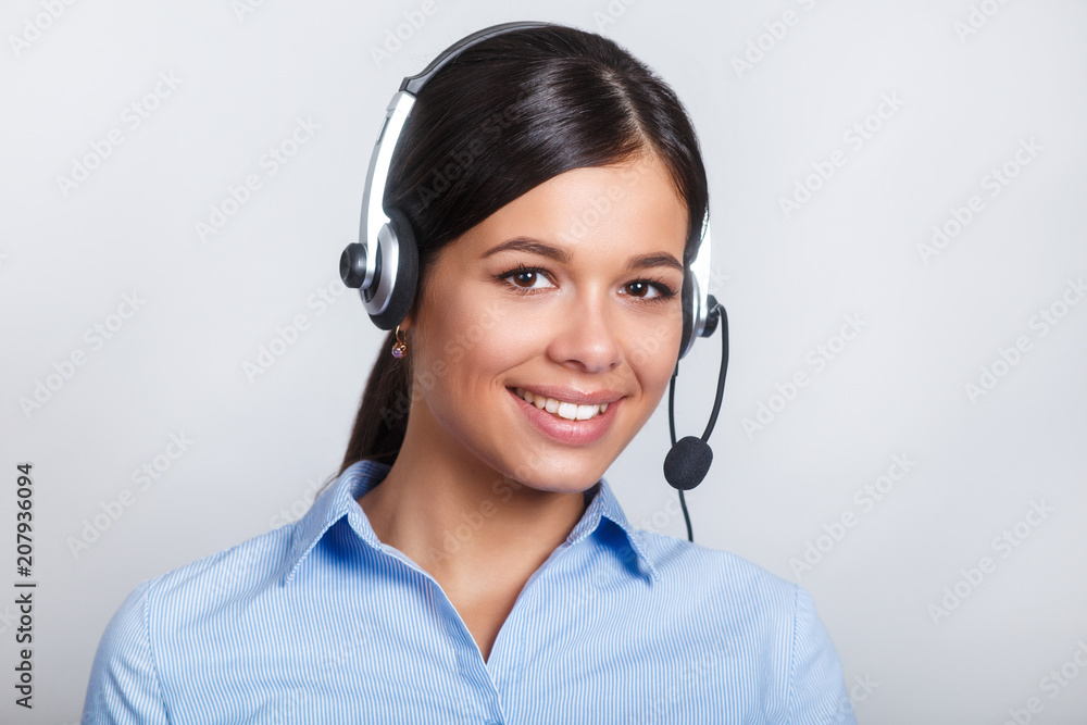 customer support phone operator in headset, with blank copyspace area for slogan or text message, over grey background. Consulting and assistance service call center. customer support phone operator in headset, with blank copyspace area for slogan or text message, over grey background. Consulting and assistance service call center.