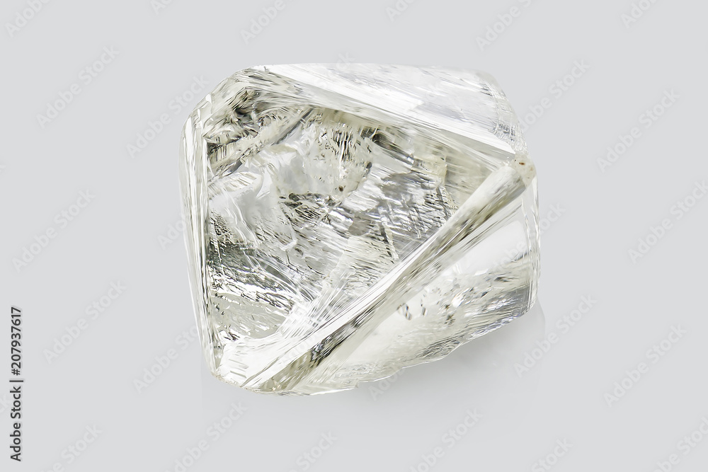 Transparent rough diamond isolated on white background Transparent rough diamond isolated on white background