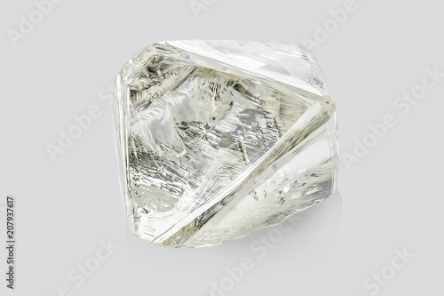 Transparent rough diamond isolated on white background
