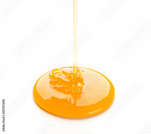 Flowing honey isolated on white background