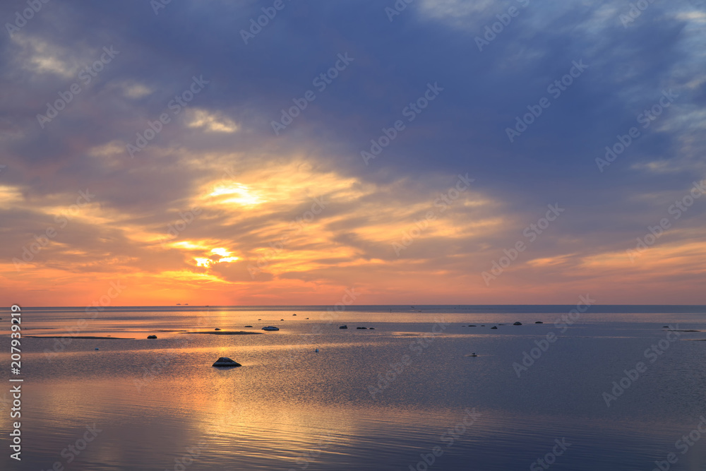 Fototapeta premium Baltic sea - early morning golden sunrise over the sea. Kurzeme, Latvia