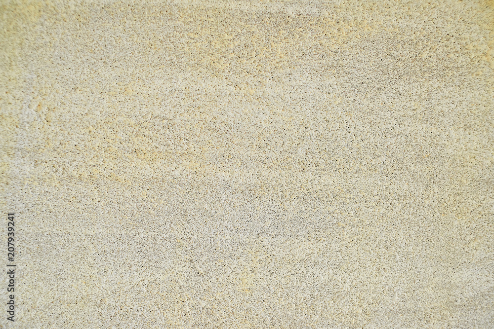 Fototapeta premium Pale yellow texture of concrete plastered wall