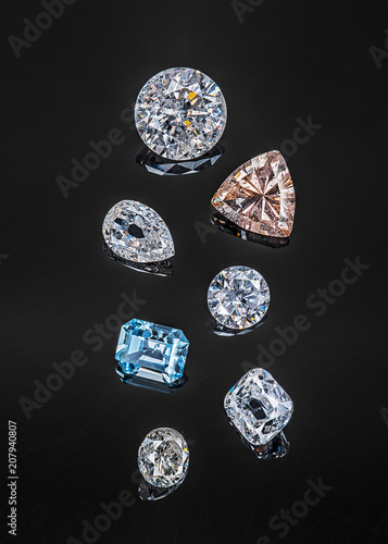 Colorful precious stones isolated on black background