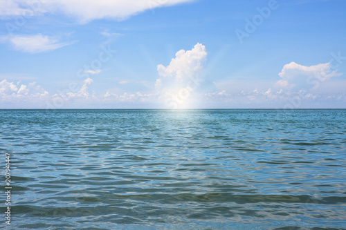 Sea view from tropical beach with sunny blue sky