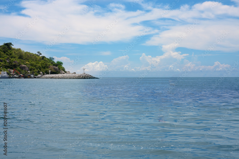 Sea view from tropical beach with sunny blue sky