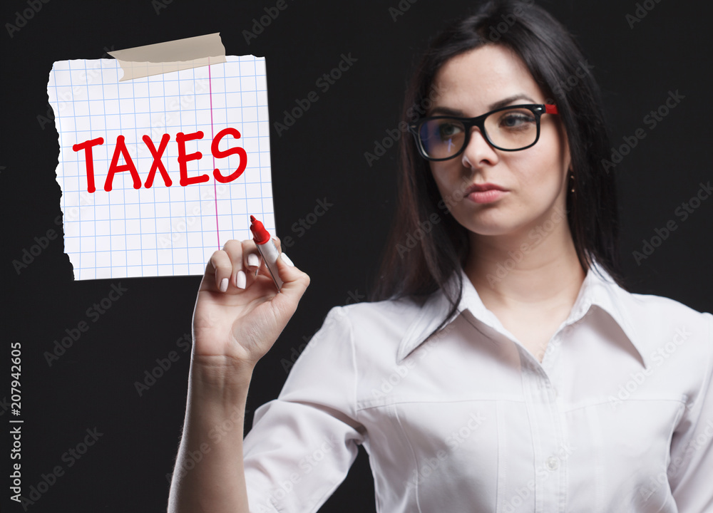The concept of marketing, technology, the Internet and the network. A young businessman shows what is important for business: Taxes The concept of marketing, technology, the Internet and the network. A young businessman shows what is important for business: Taxes