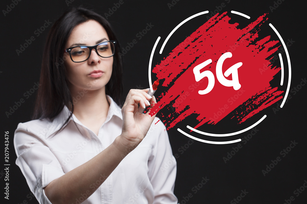 The concept of marketing, technology, the Internet and the network. A young businessman shows what is important for business: 5G The concept of marketing, technology, the Internet and the network. A young businessman shows what is important for business: 5G