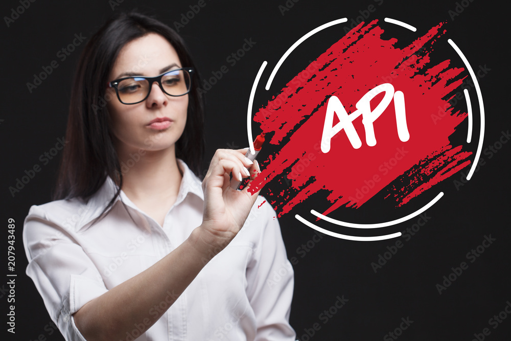 The concept of marketing, technology, the Internet and the network. A young businessman shows what is important for business: API The concept of marketing, technology, the Internet and the network. A young businessman shows what is important for business: API