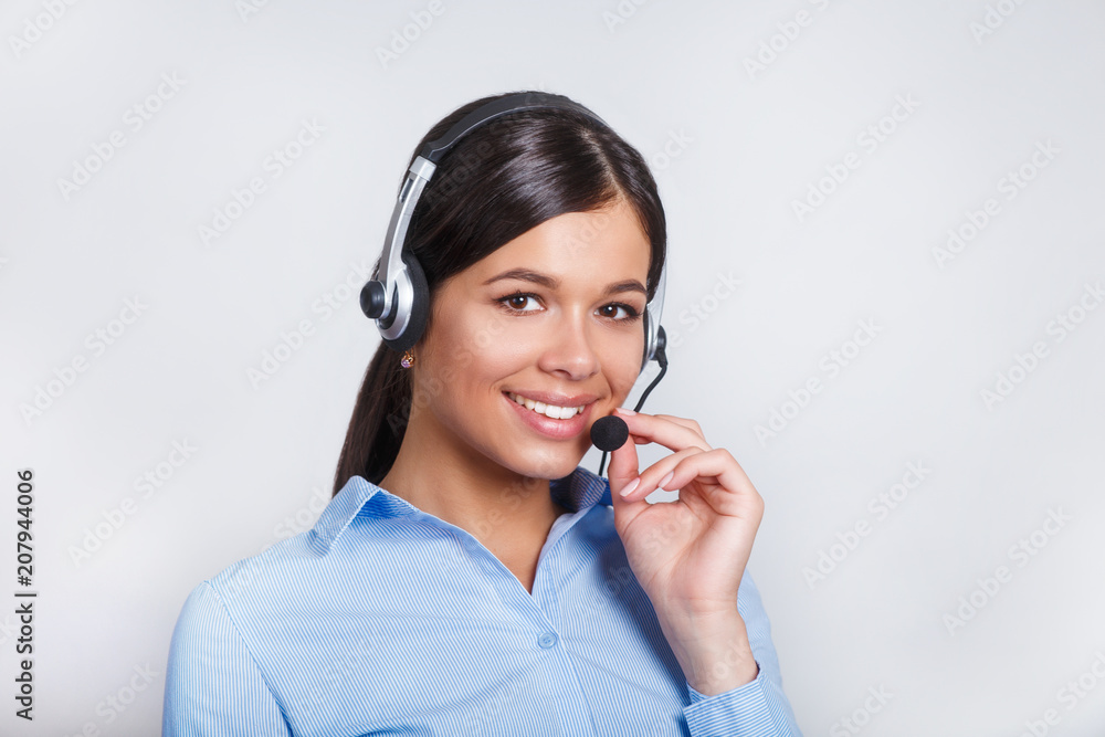 customer support phone operator in headset, with blank copyspace area for slogan or text message, over grey background. Consulting and assistance service call center. customer support phone operator in headset, with blank copyspace area for slogan or text message, over grey background. Consulting and assistance service call center.