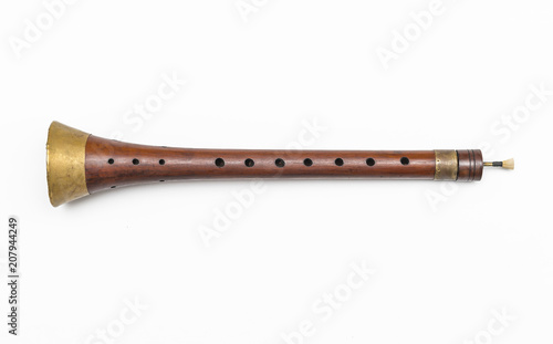 Zurla. Isolated image of traditional Serbian woodwind musical instrument. photo