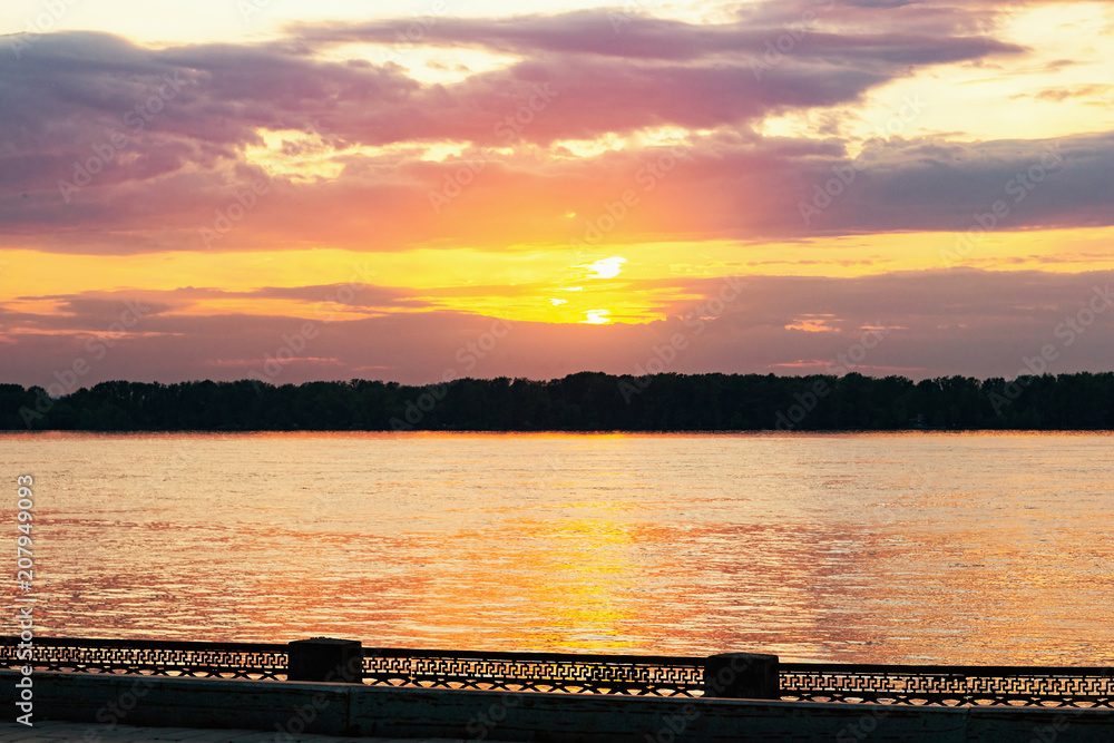 Sunset cityscape of Volga river embankment, Samara, Russia. Sunset cityscape of Volga river embankment, Samara, Russia.
