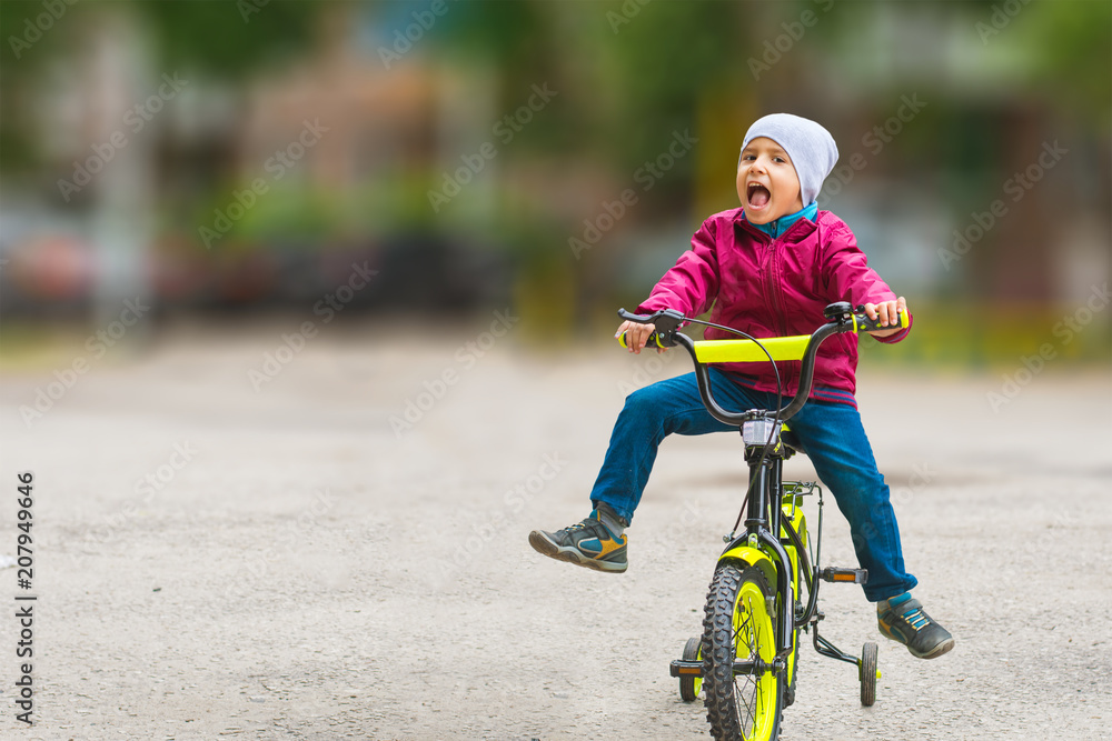 boy on bike with blurred background boy on bike with blurred background