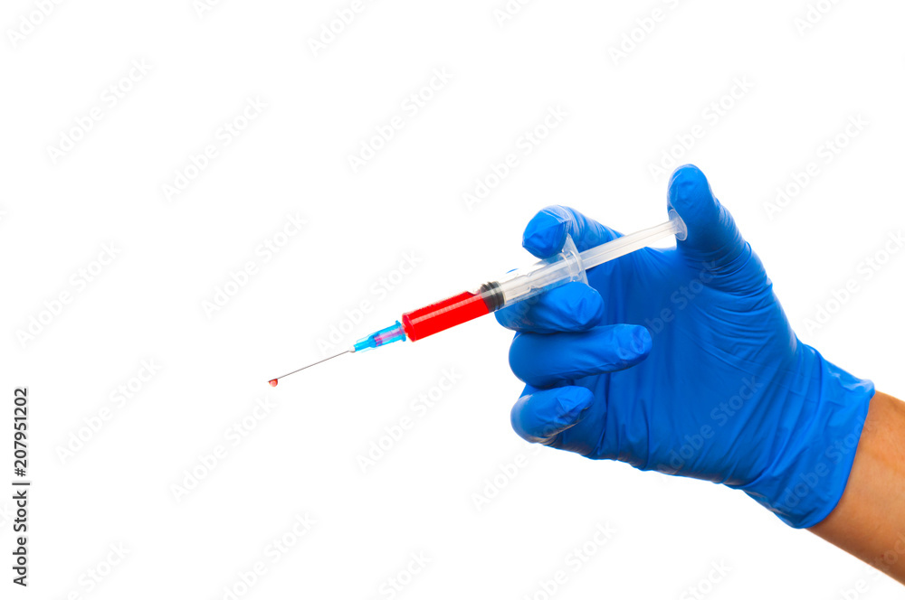 Hand in blue glove with syringe isolated on white background Hand in blue glove with syringe isolated on white background