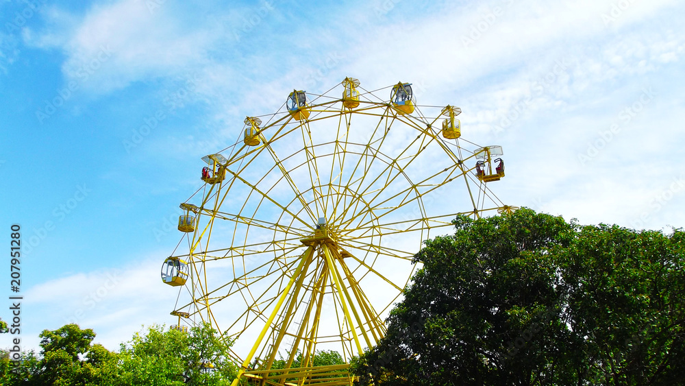 Rest in the amusement Park.Ferris wheel.