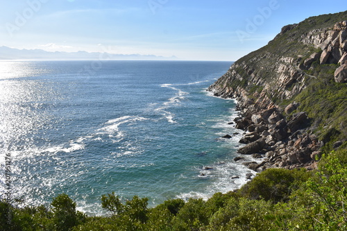 Wonderful landscape with the blue beach at the hiking trail at Robberg Nature Reserve in Plettenberg Bay, South Africa photo