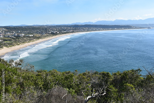 Wonderful landscape with the blue beach at the hiking trail at Robberg Nature Reserve in Plettenberg Bay, South Africa photo