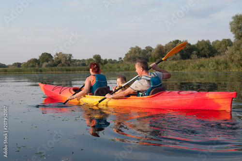 Family in a kayak on a water walk