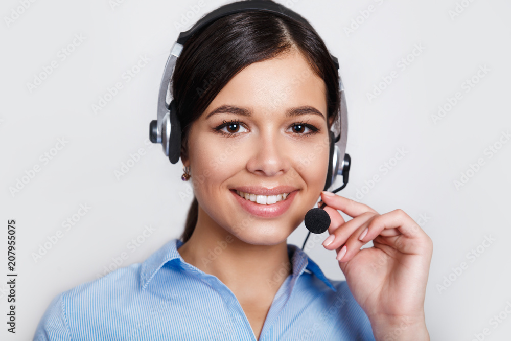 customer support phone operator in headset, with blank copyspace area for slogan or text message, over grey background. Consulting and assistance service call center. customer support phone operator in headset, with blank copyspace area for slogan or text message, over grey background. Consulting and assistance service call center.