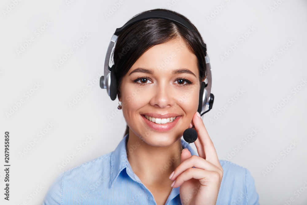 customer support phone operator in headset, with blank copyspace area for slogan or text message, over grey background. Consulting and assistance service call center. customer support phone operator in headset, with blank copyspace area for slogan or text message, over grey background. Consulting and assistance service call center.