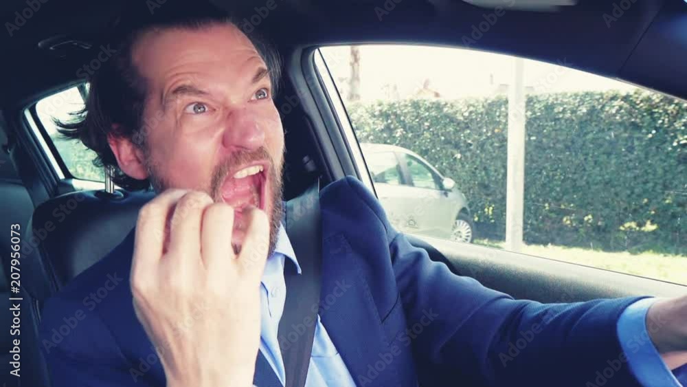 Man in car screaming for success driving slow motion Man in car screaming for success driving slow motion