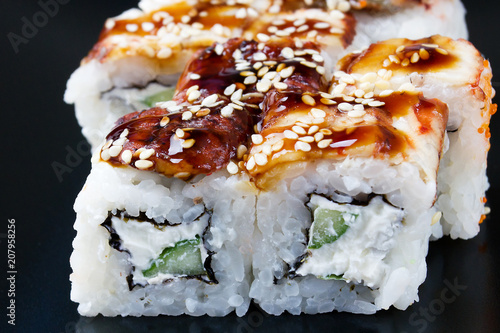 Set of rolls with eel, cheese, sesame
