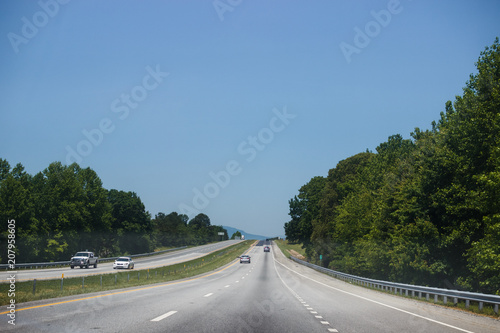 Highway against the cloudless blue sky.