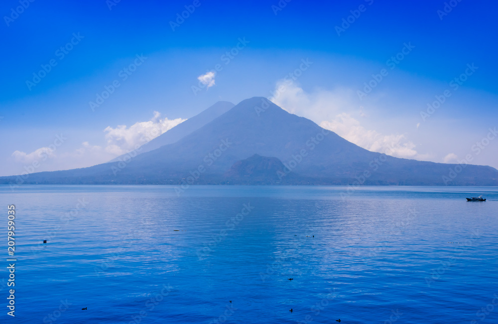Beautiful landscape of Atitlan Lake, is the deepest lake in all of Central America with a maximum depth of about 340 meters, with volcano in Background Beautiful landscape of Atitlan Lake, is the deepest lake in all of Central America with a maximum depth of about 340 meters, with volcano in Background
