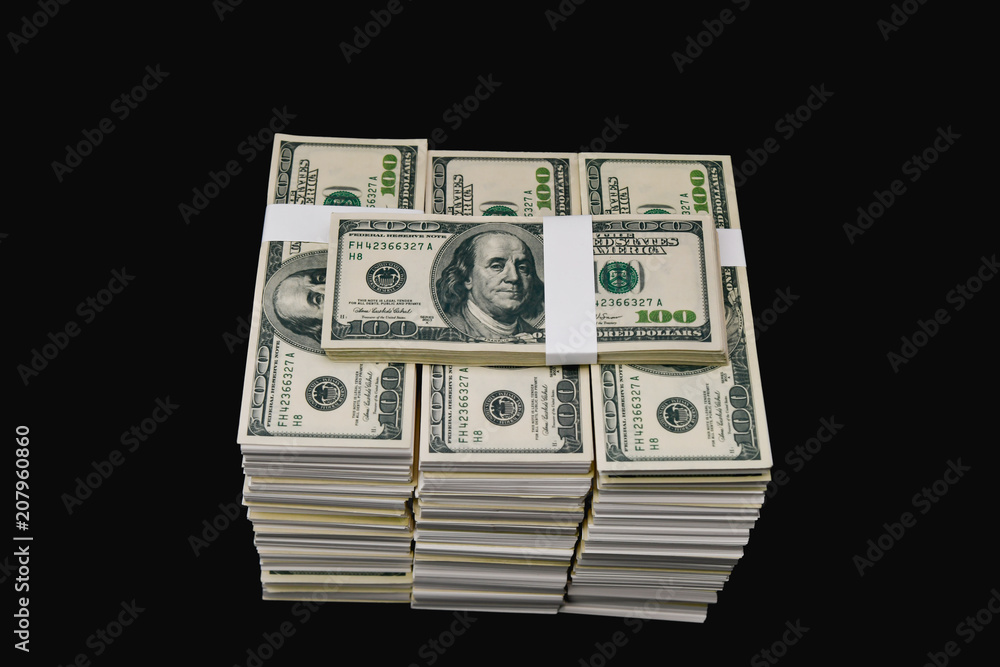 Finance Business Concepts. Lots of money on a black background. Investments are a necessity of business. Businessman looking at a lot of money. Finance Business Concepts. Lots of money on a black background. Investments are a necessity of business. Businessman looking at a lot of money.