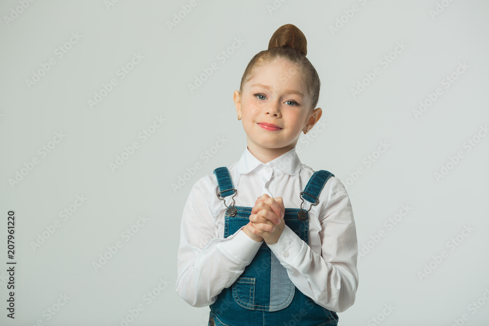 beautiful little smiling girl on a light background beautiful little smiling girl on a light background