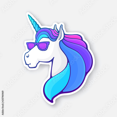 Sticker of fairy tale unicorn head in sunglasses with a rainbow mane