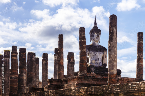 Buddha among columns in Sukhothai Historical Park in Thailand
