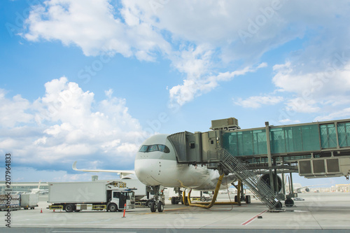 Loading cargo on plane in airport. cargo plane loading for logistic and transport. view through window Passenger terminal